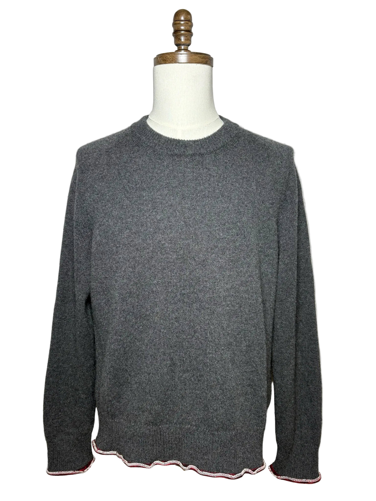Grey sweater with red and white trim 