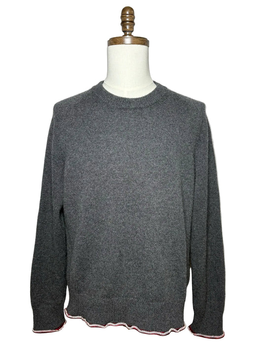 Grey sweater with red and white trim 