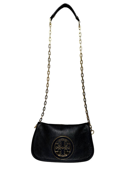 Black Tory Burch Purse with a gold logo and gold chain crossbody strap in front of a white background