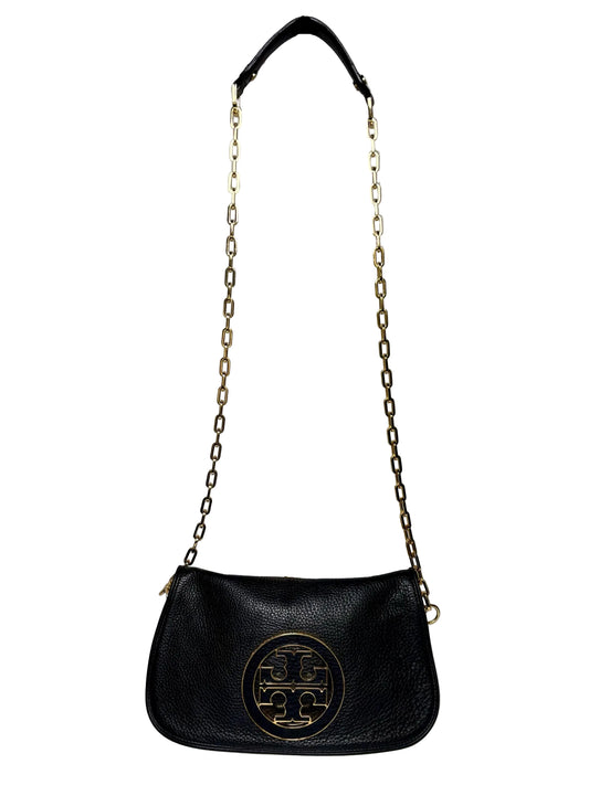 Black Tory Burch Purse with a gold logo and gold chain crossbody strap in front of a white background