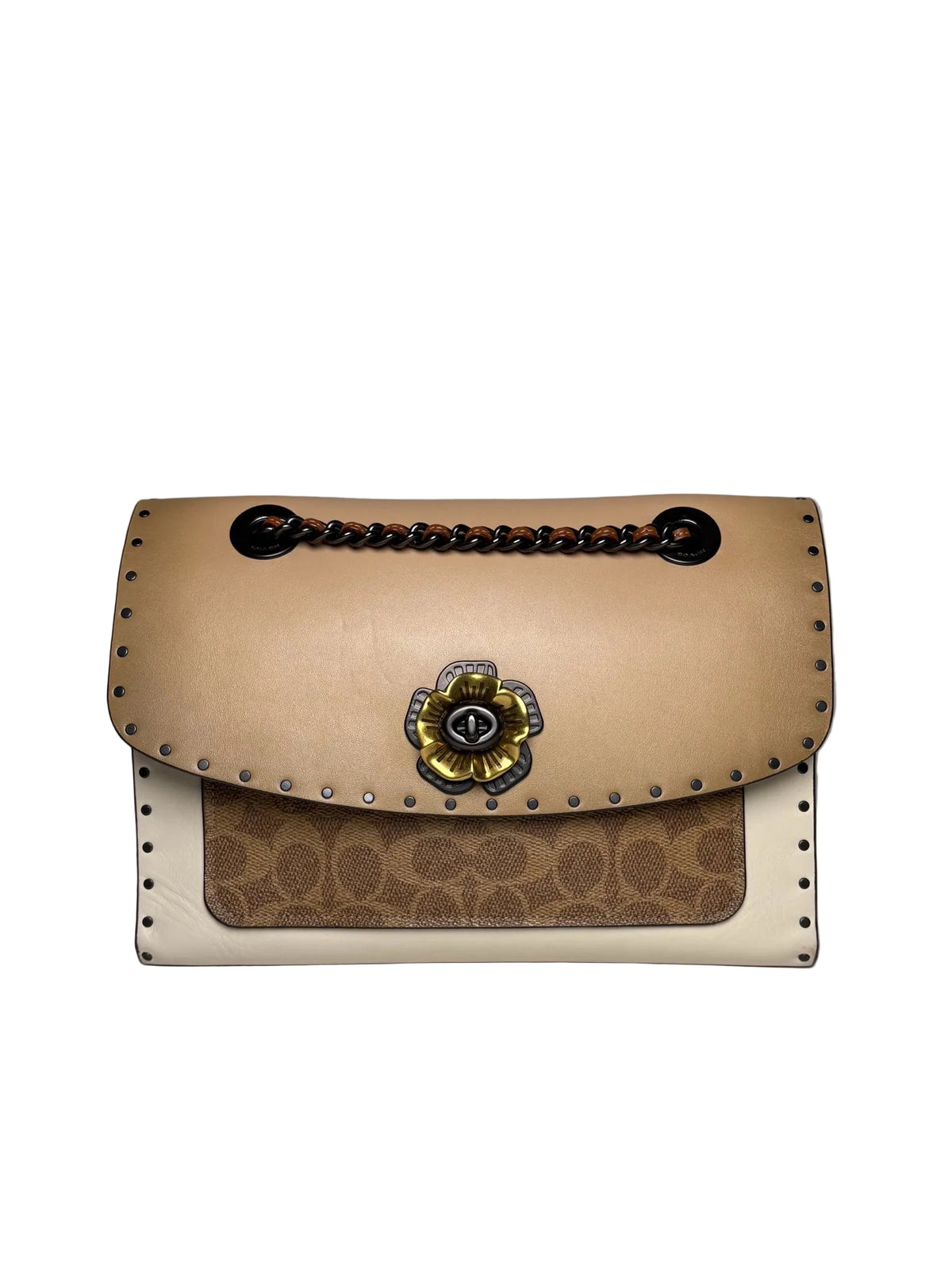 Tan and white coach bag with a bronze floral latch