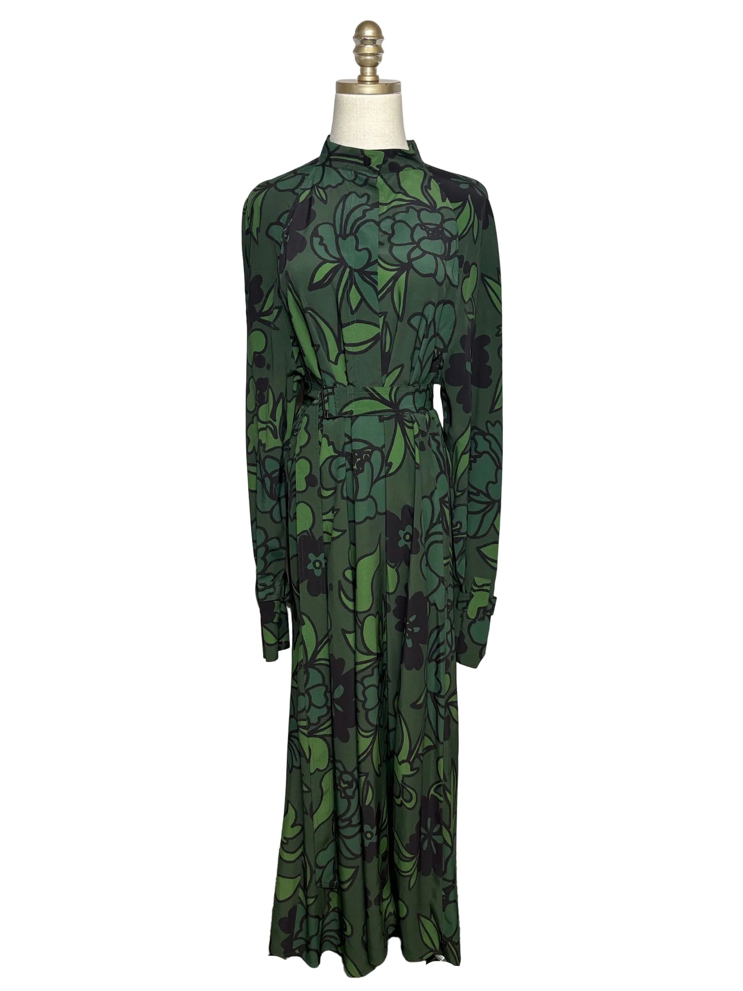Green dress on a mannequin in front of a white background