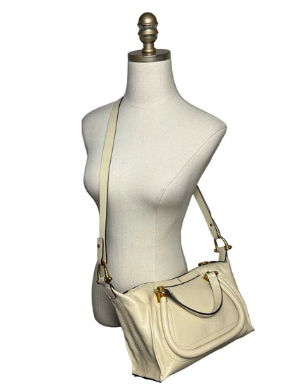 Mannequin wearing cream Chloe crossbody bag