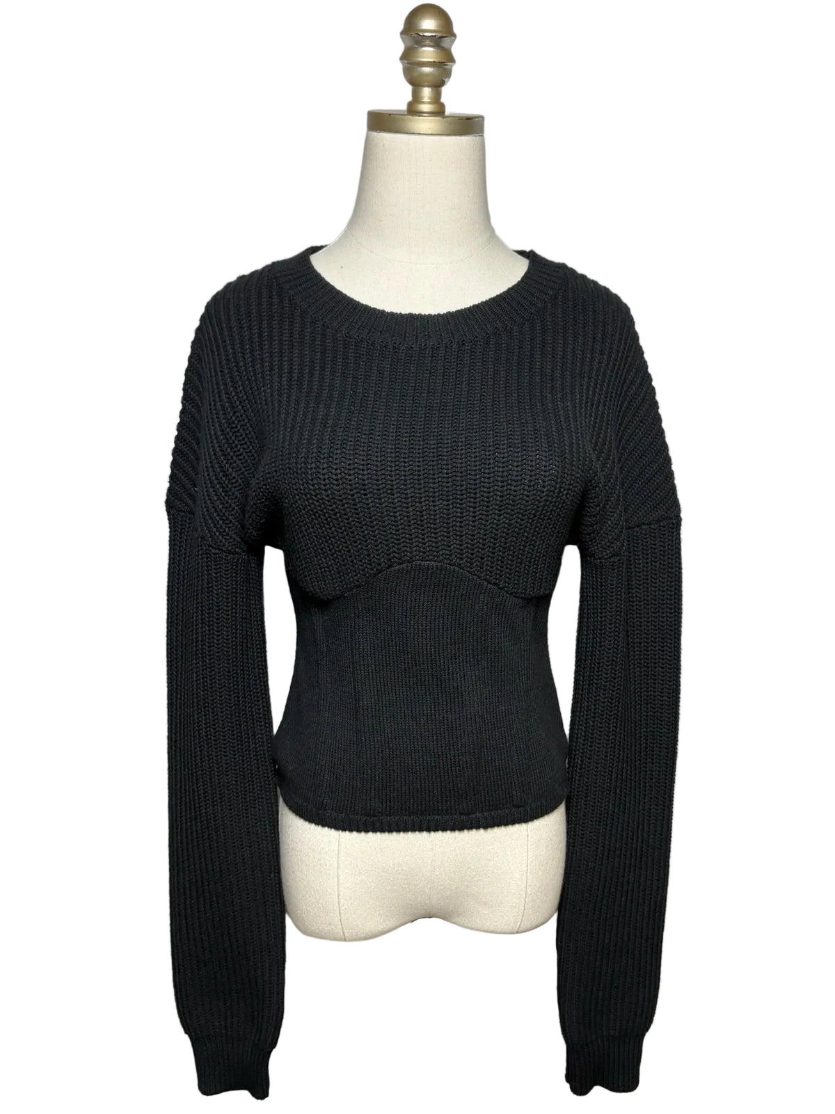 Black knit sweater on mannequin