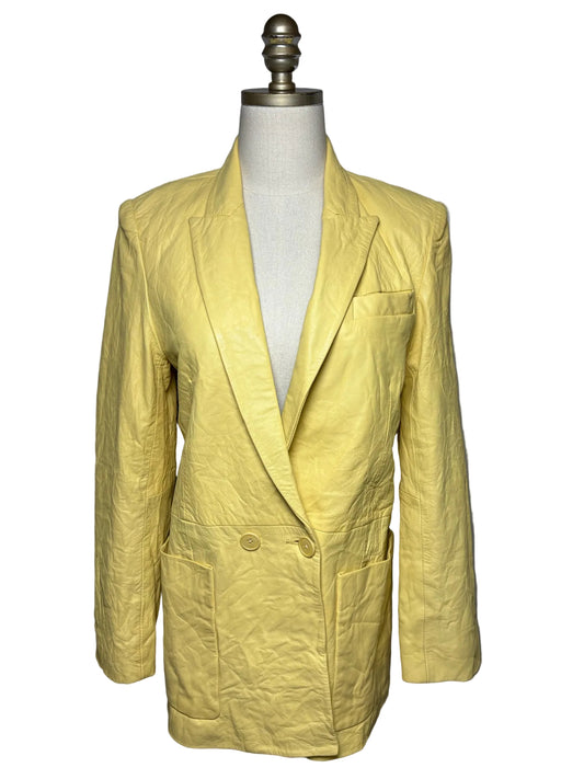 Butter yellow leather blazer on mannequin