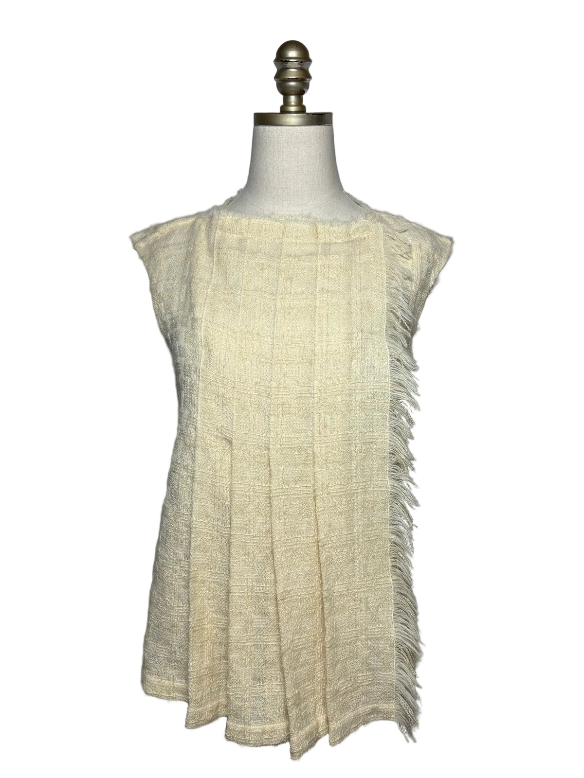 Cream Chanel frayed tweed pleated top on mannequin