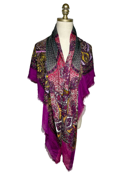 a purple patterned scarf draped over a mannequin.
