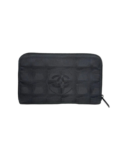 Black nylon Chanel wallet with a Chanel logo in the middle