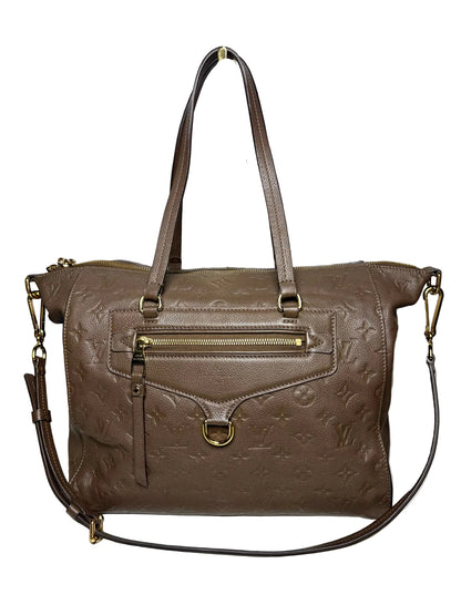 Brown Louis Vuitton bag with two handles, a crossbody strap, and gold hardware.  The bag is in front of a white background.