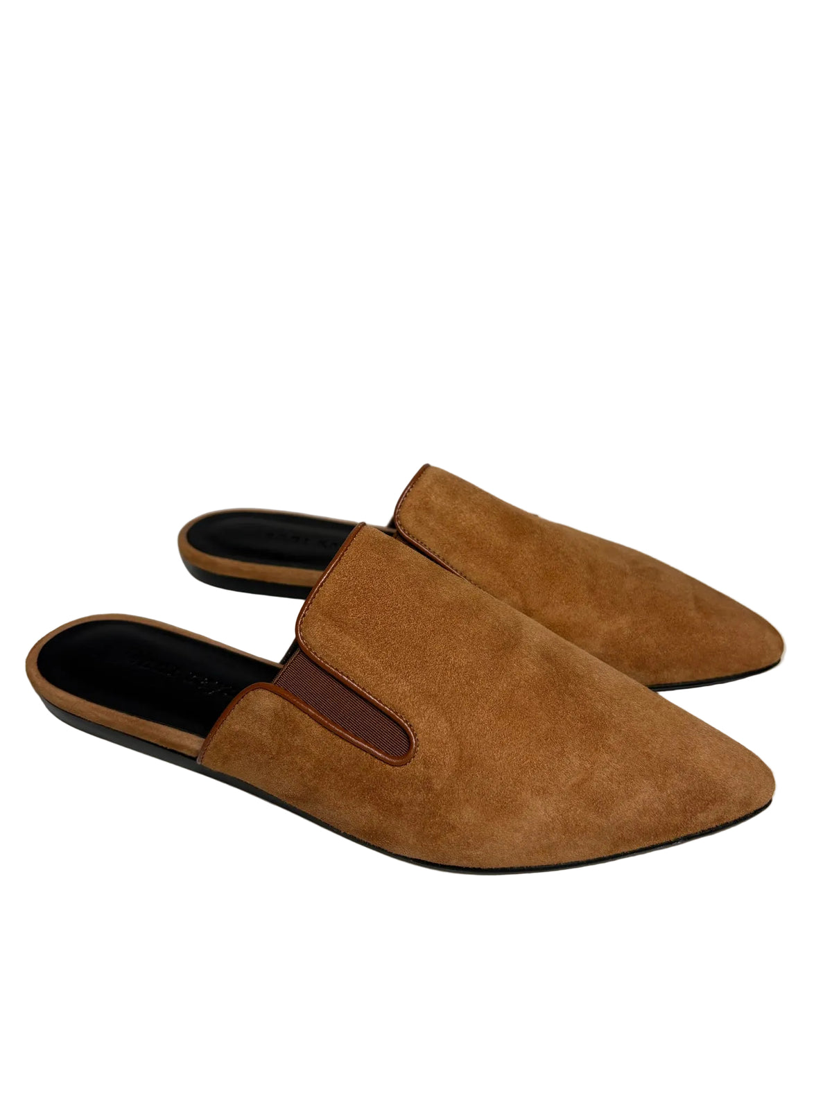 Brown suede slip on loafers in front of a white background