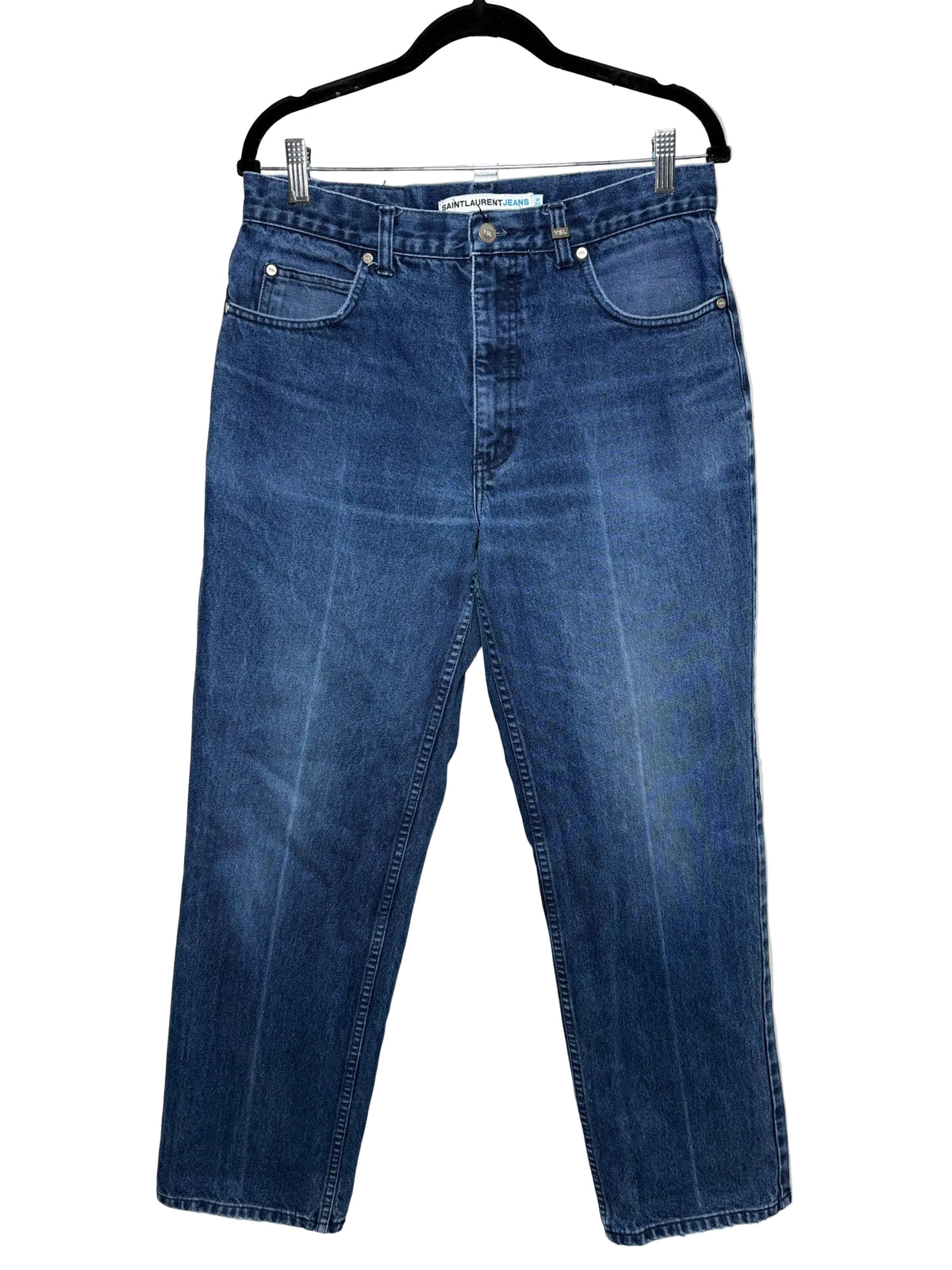 Blue jeans on a black hanger