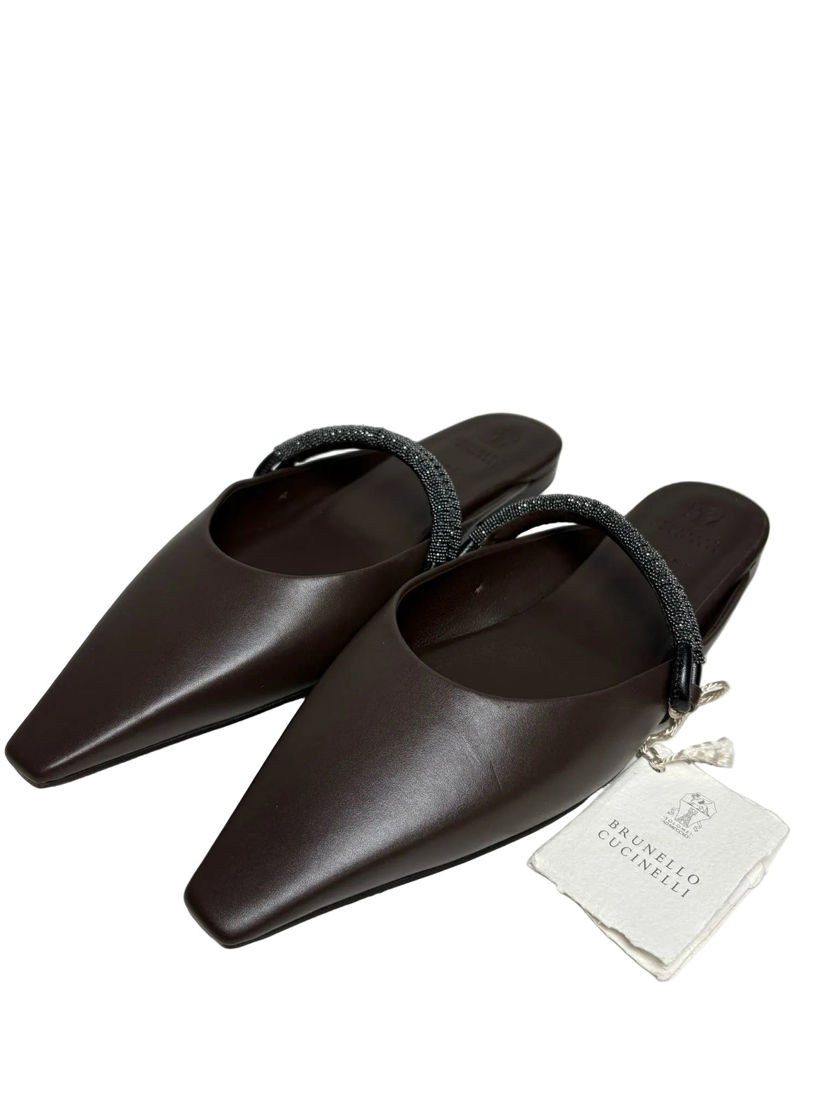 Brown Brunello Cucinelli slip-on mules with a tag.