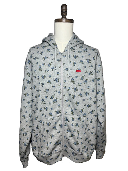 Grey Supreme hoodie with blue floral pattern and a red Supreme logo on left chest
