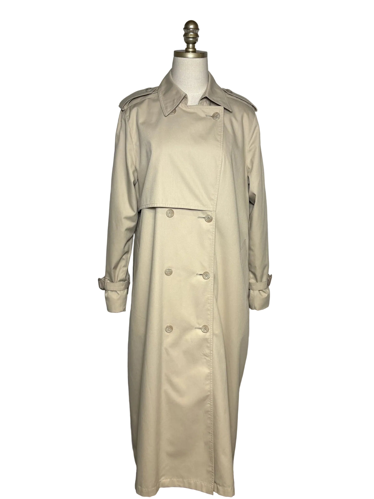 Tan trench coat with eight buttons on a mannequin in front of a white background