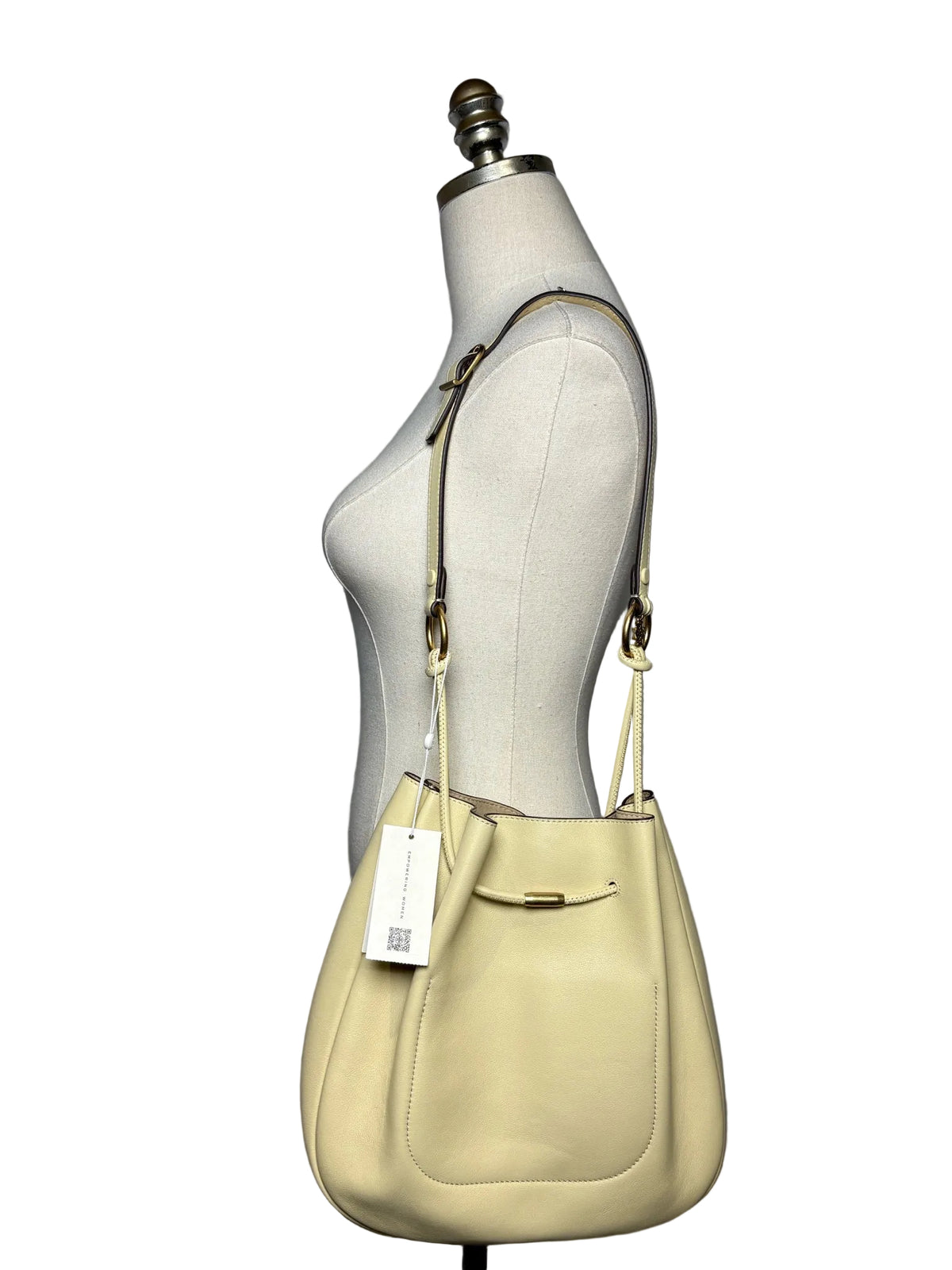 Mannequin wearing a yellow shoulder bag