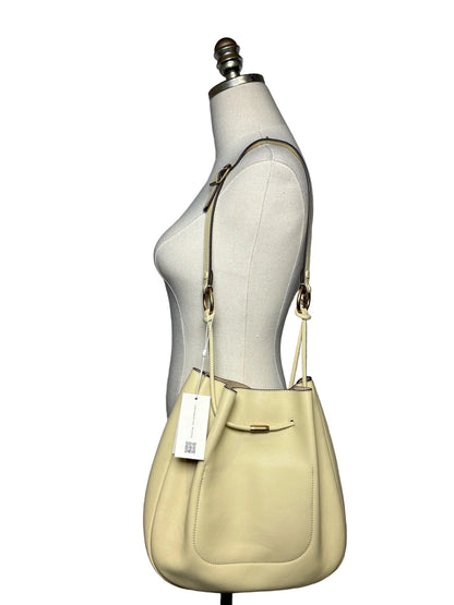 Mannequin wearing a yellow shoulder bag