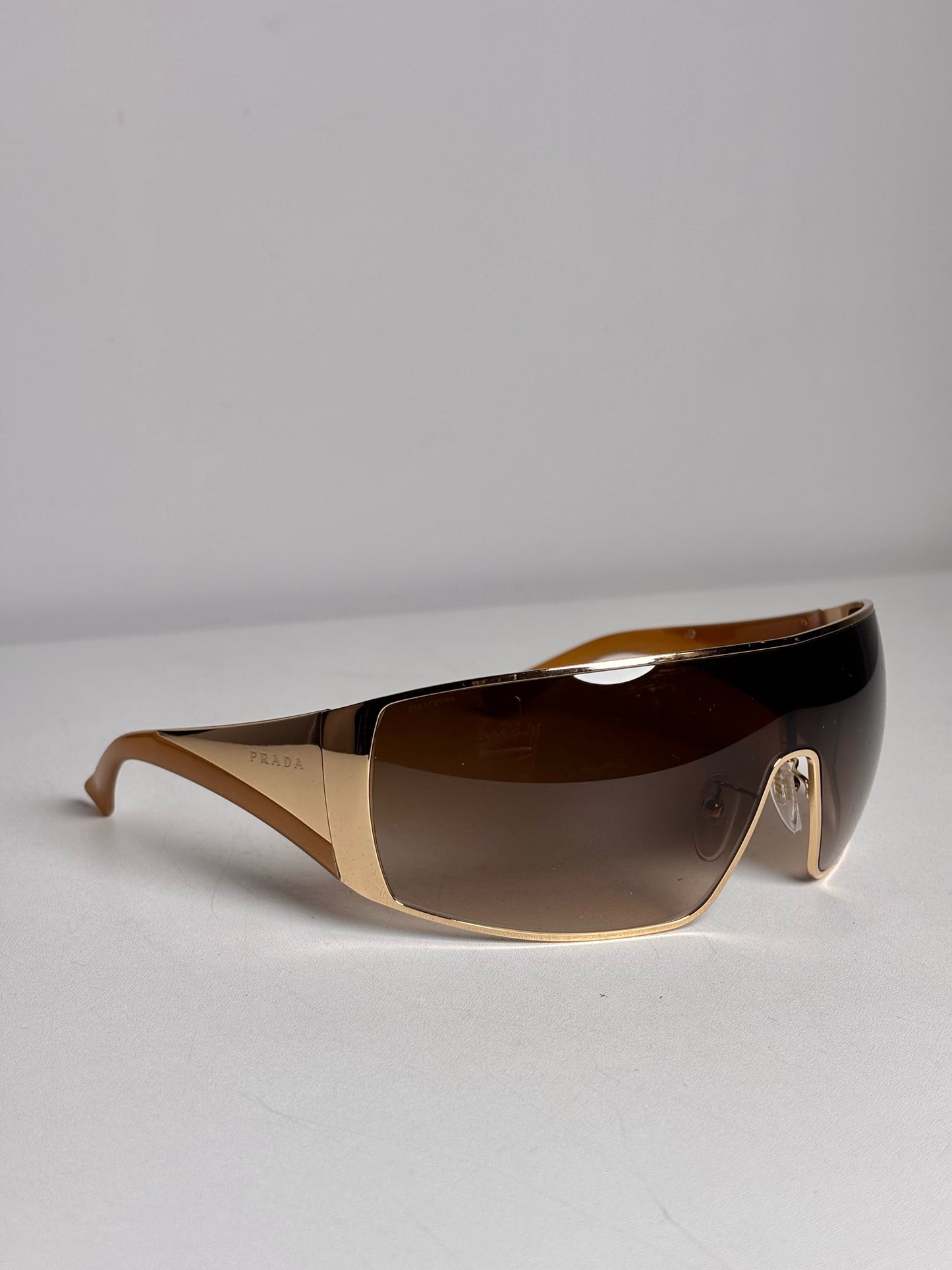 Prada Pre-owned Gold Shield SPR 57H Eyewear