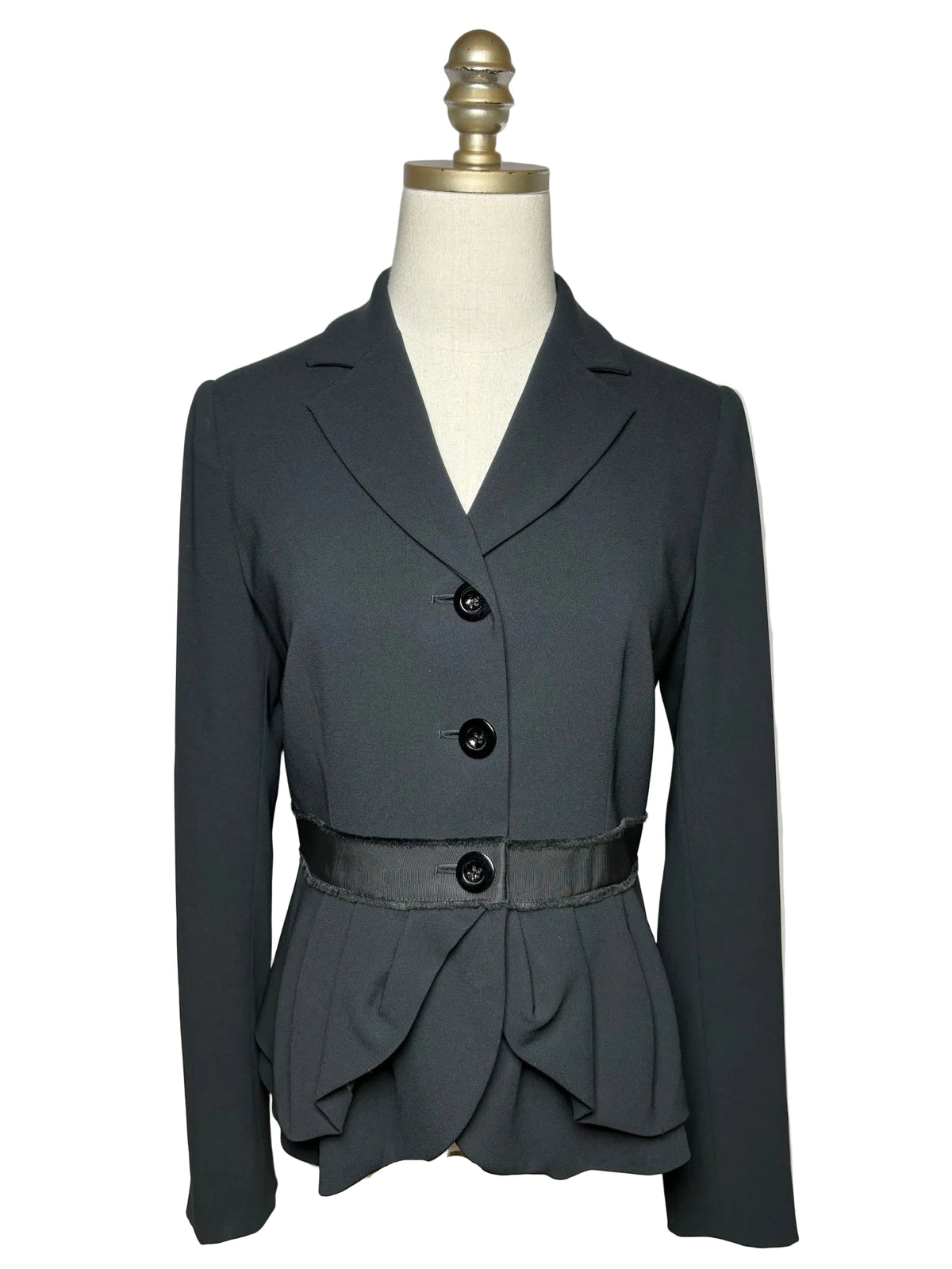 Black blazer on a mannequin.