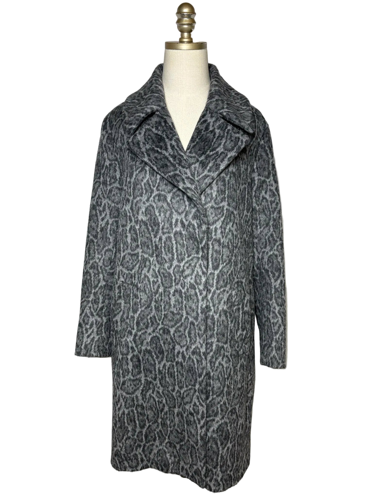 Grey animal print jacket on a mannqeuin.