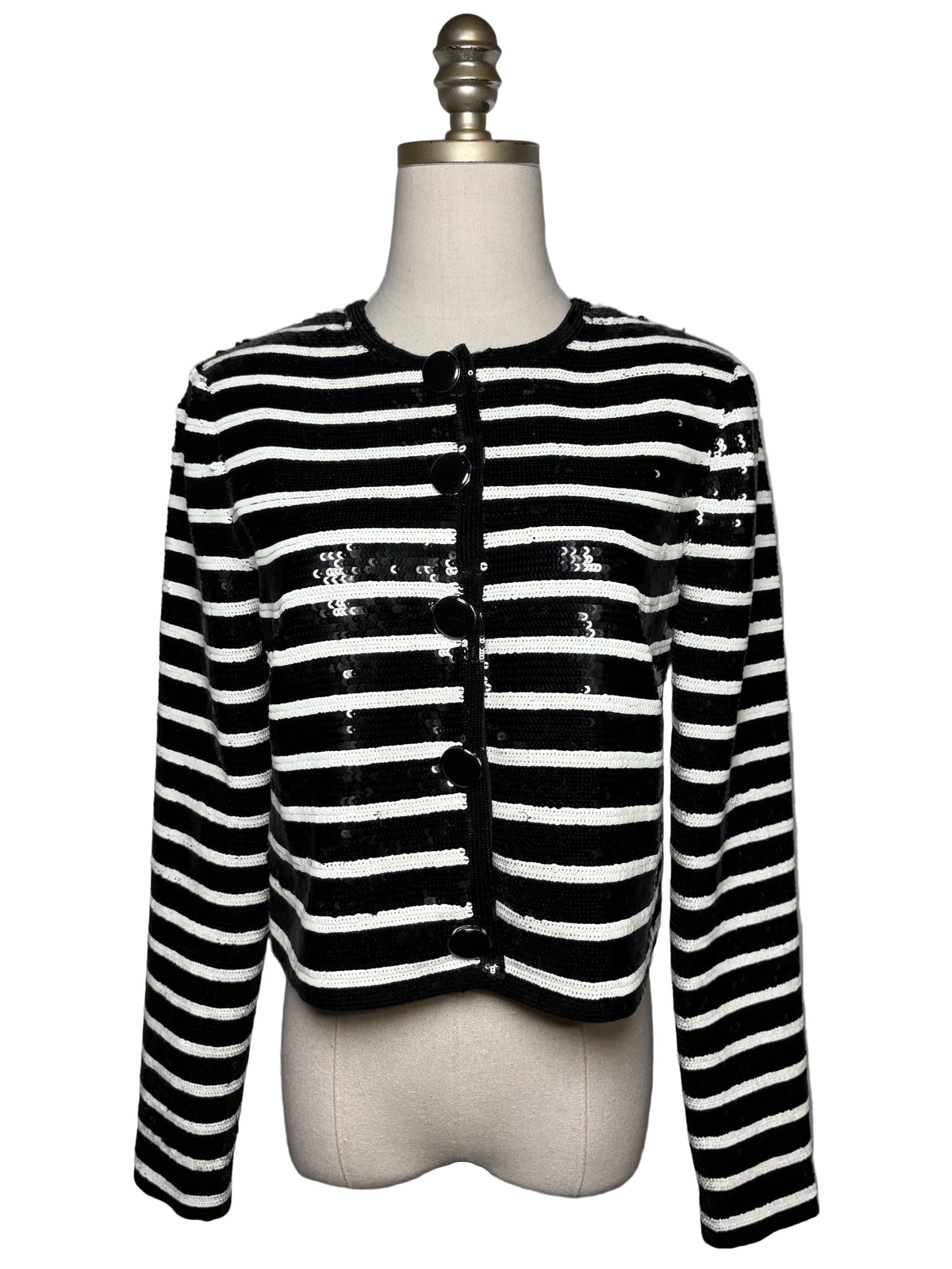 Mannequin wearing black and white stripe sequin jacket