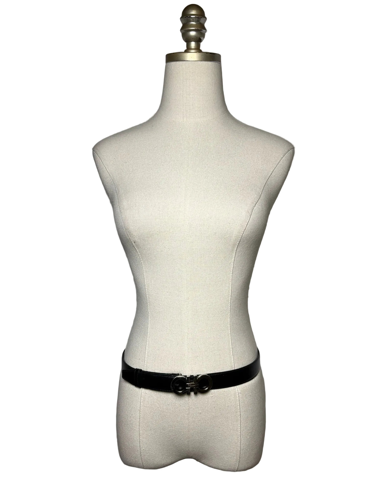 Black belt with silver tone buckle on a mannequin