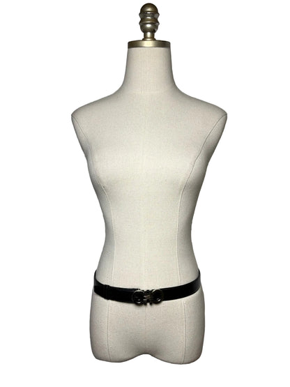 Black belt with silver tone buckle on a mannequin