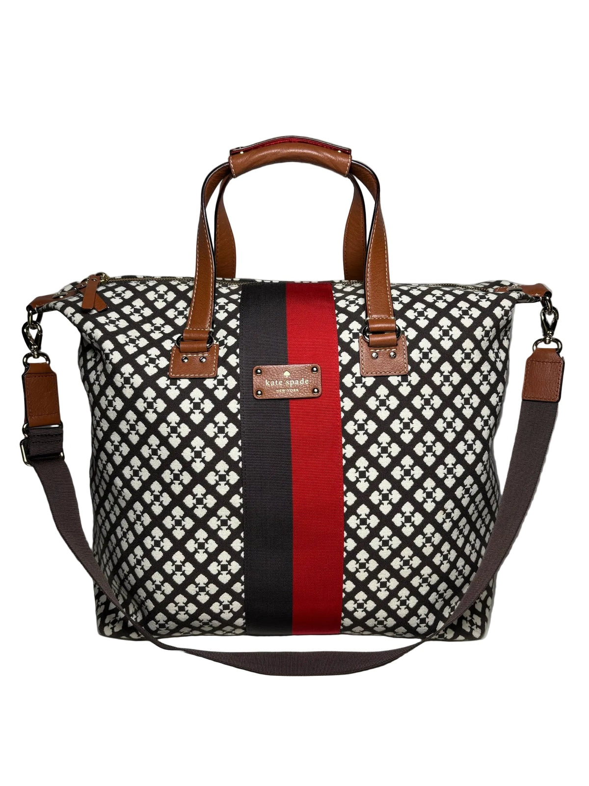 Kate Spade black and white weekender bag with a black and red stripe accent down the middle. Brown crossbody strap with light brown leather handles