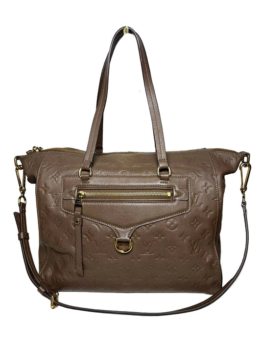 Brown Louis Vuitton bag with two handles, a crossbody strap, and gold hardware.  The bag is in front of a white background.